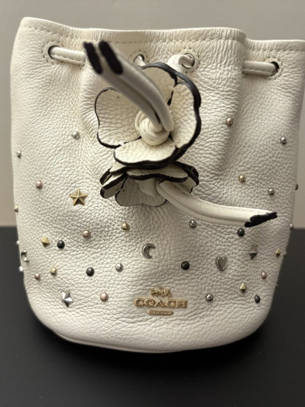 Coach White Petal Pebbled Leather Wristlet with Metallic Embellishments NWT